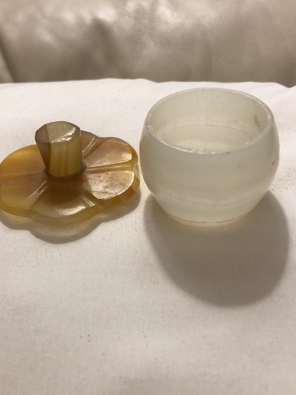 Hand-carved translucent alabaster lidded jar with flower-shaped cover